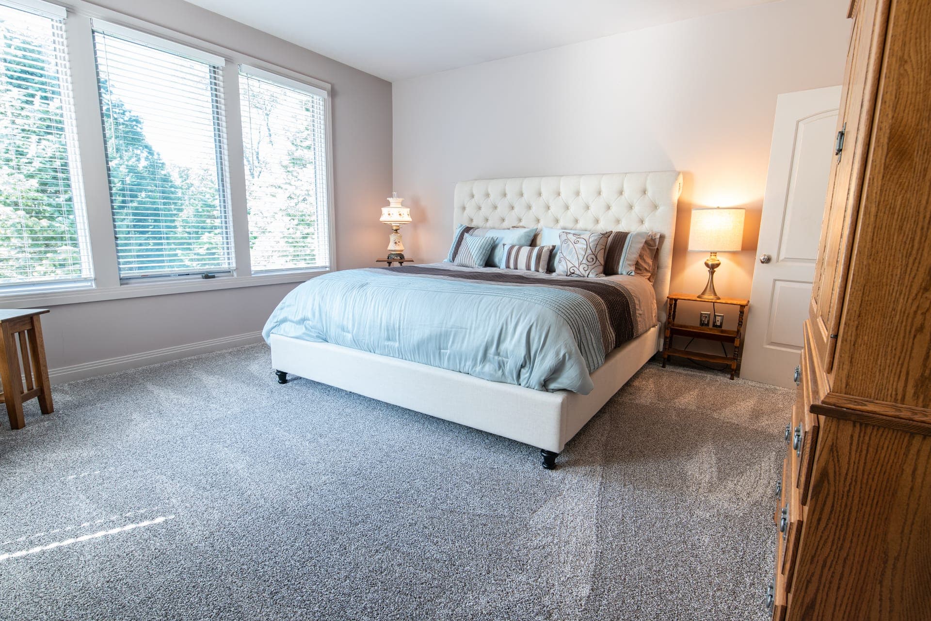 Clean, fresh-made bed in a tidy bedroom